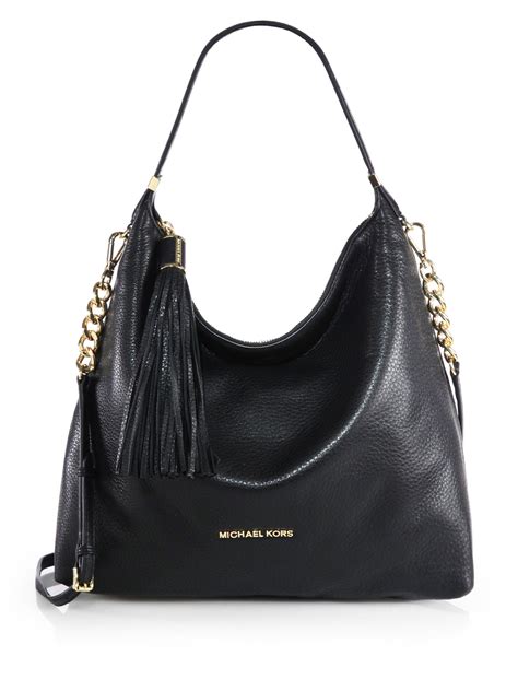 michael kors black tassel bag|Michael Kors black studded bag.